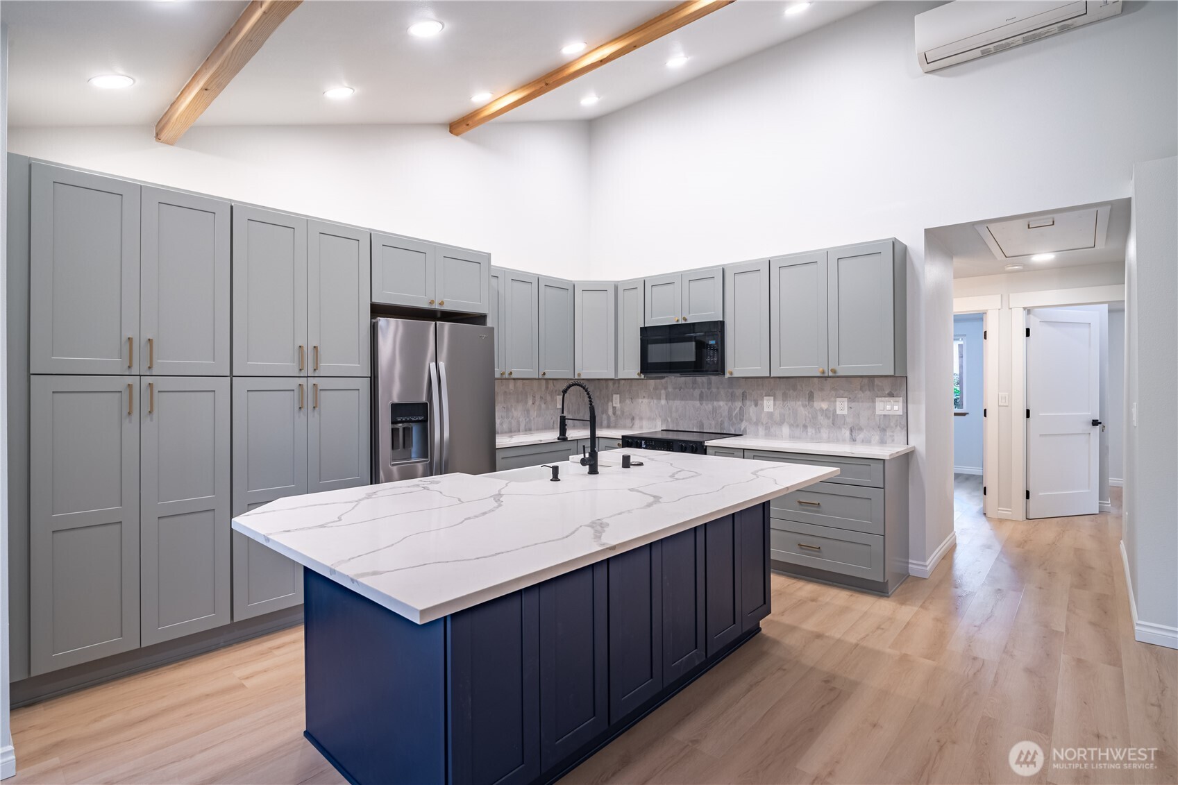 2802 Garden Court, Unit A Steilacoom, WA 98388 - Photo 5 of 29 a kitchen with a sink refrigerator and wooden cabinets