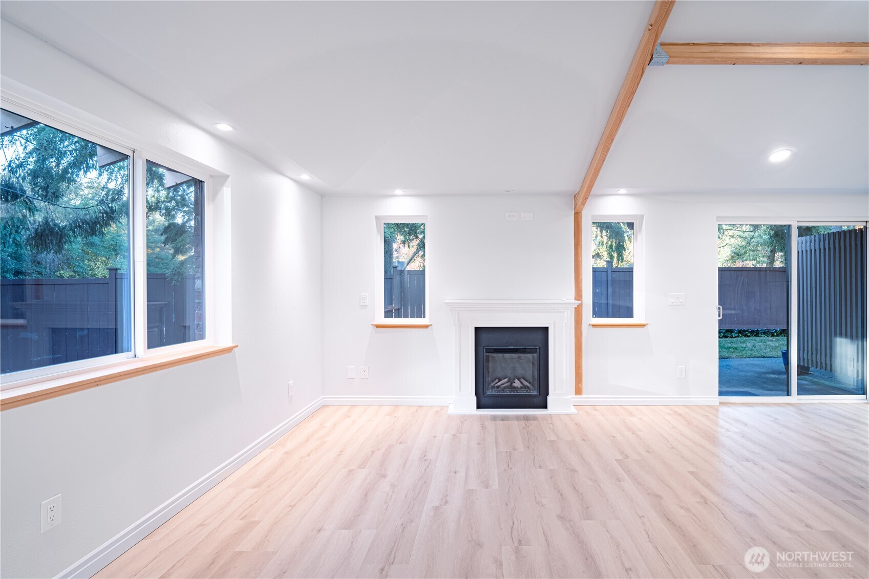 2802 Garden Court, Unit A Steilacoom, WA 98388 - Photo 8 of 29 a view of empty room with wooden floor and fan