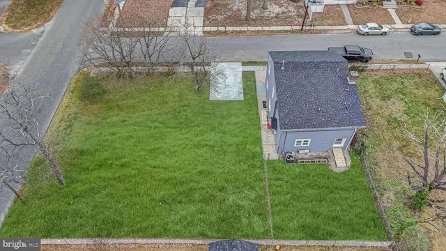 aerial view of a house with a yard
