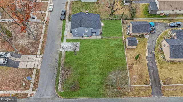 front view of a brick house with a yard