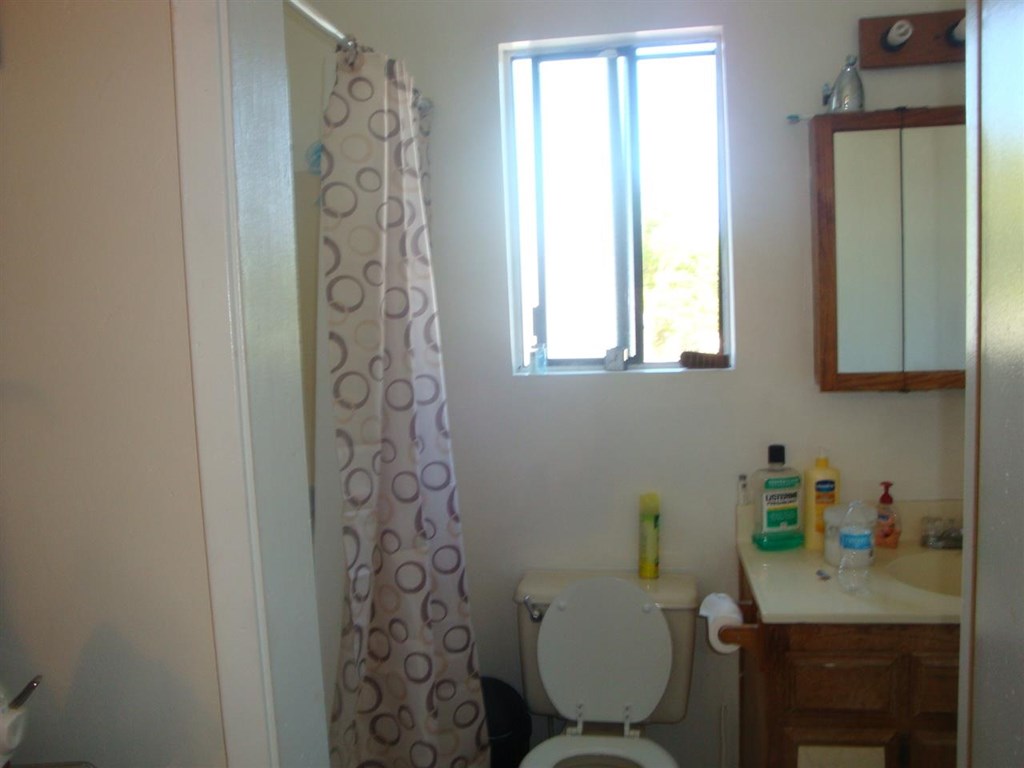488 D Street Chula Vista, CA 91910 - Photo 17 of 19 a bathroom with a sink a toilet and a shower