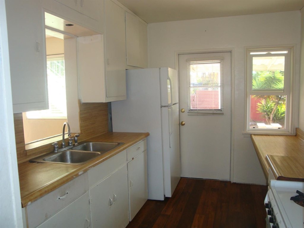 488 D Street Chula Vista, CA 91910 - Photo 6 of 19 a kitchen with a sink cabinets and a window