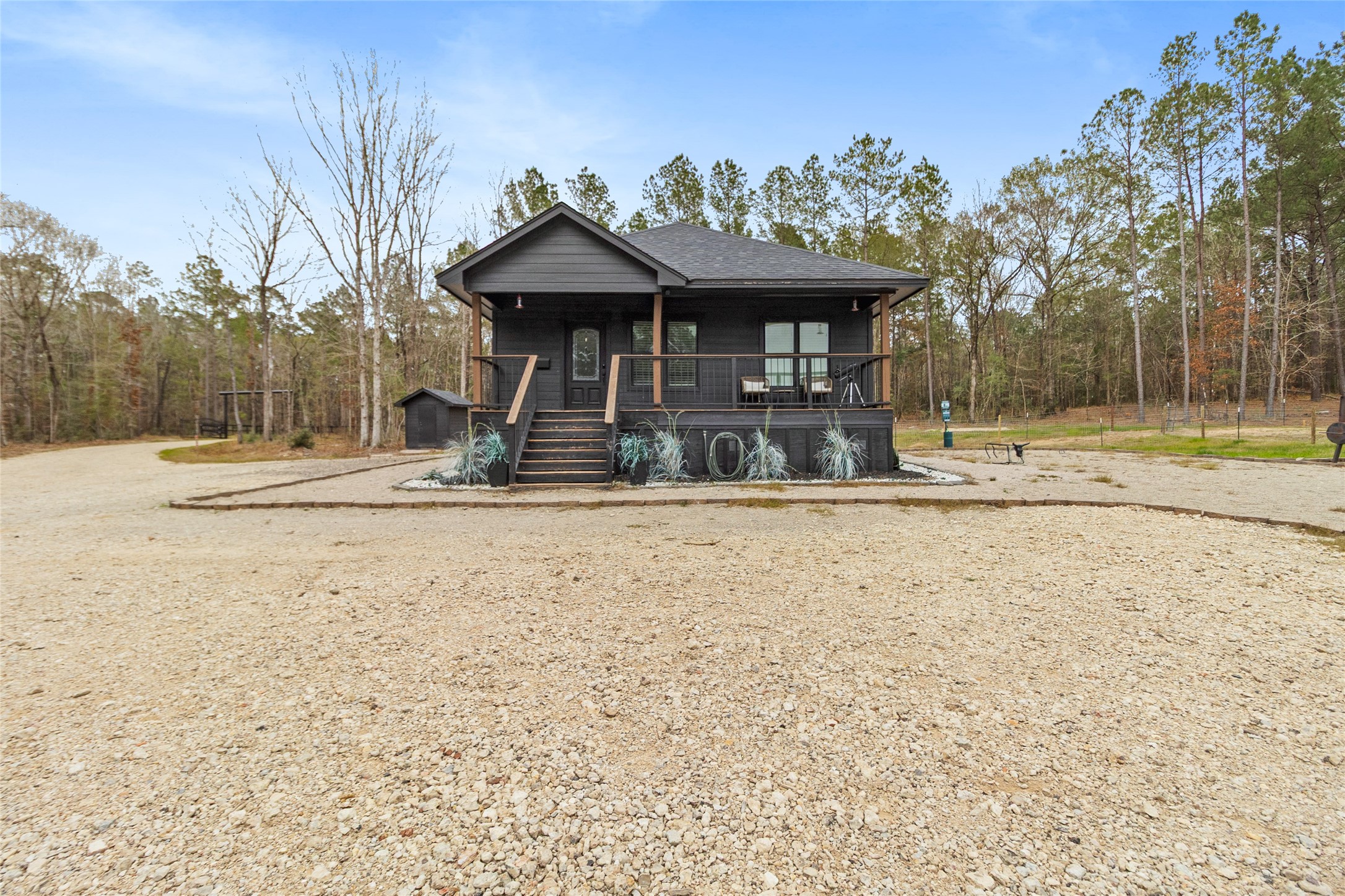 180 Jordan Road Point Blank, TX 77364 - Photo 1 of 38 a view of a house with basketball court