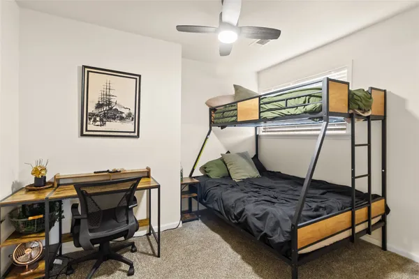a living room with a piano and furniture