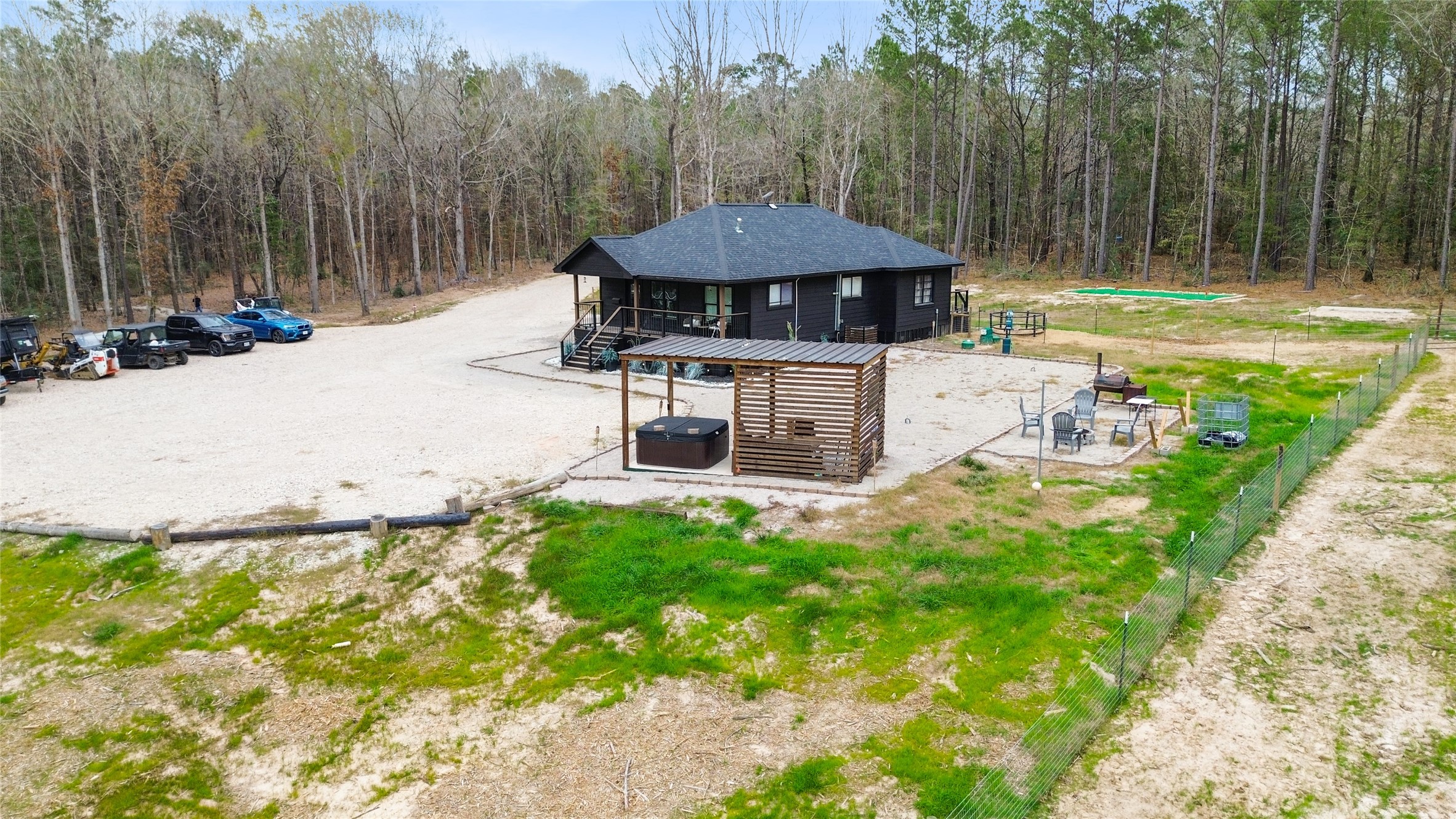 180 Jordan Road Point Blank, TX 77364 - Photo 28 of 38 a view of a house with backyard and sitting area
