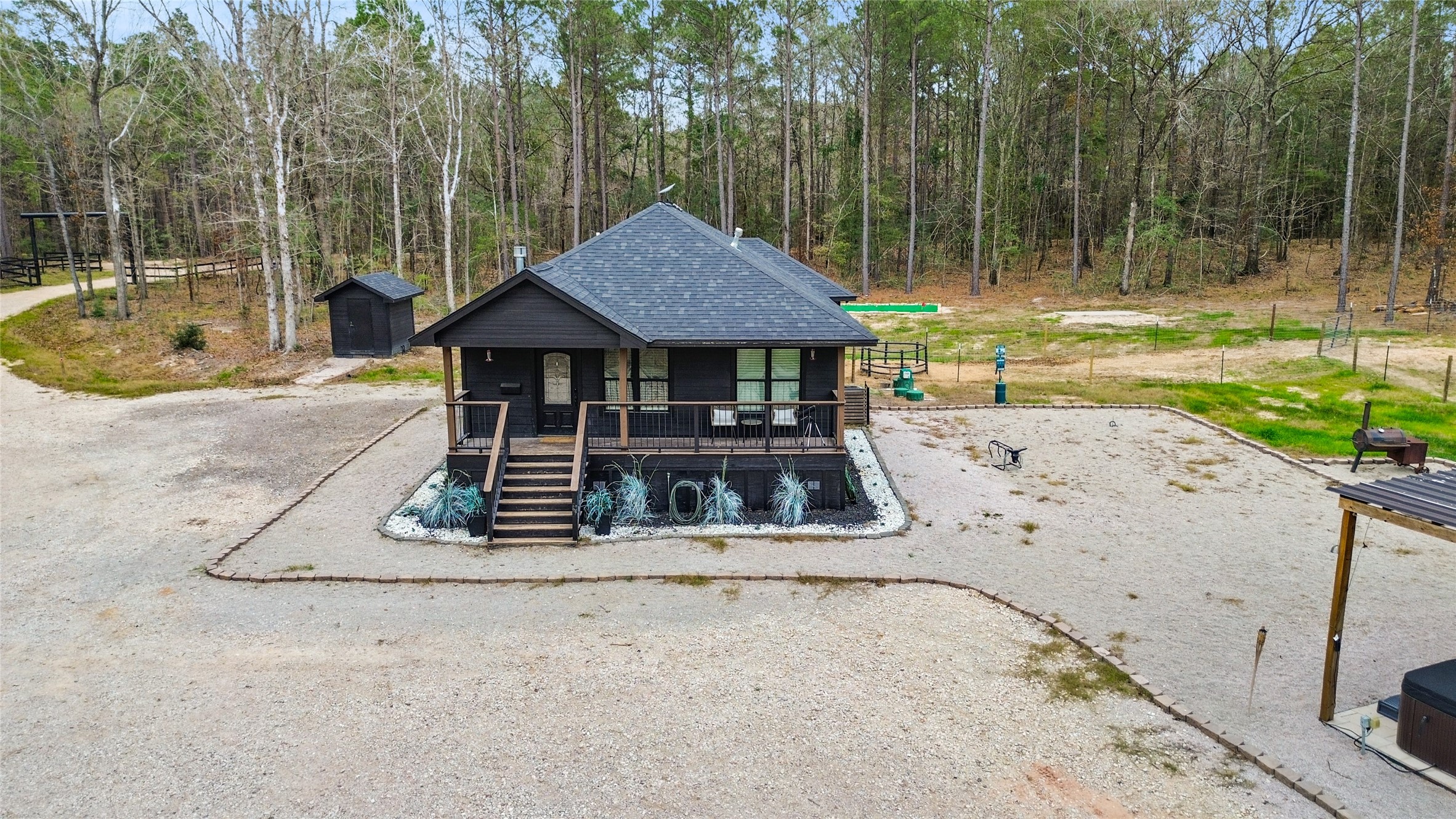 180 Jordan Road Point Blank, TX 77364 - Photo 3 of 38 a view of a house with backyard and a swimming pool