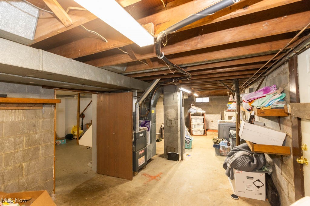 1085 Novak Road Grafton, OH 44044 - Photo 35 of 41 Unfinished basement with heating unit and washer / clothes dryer