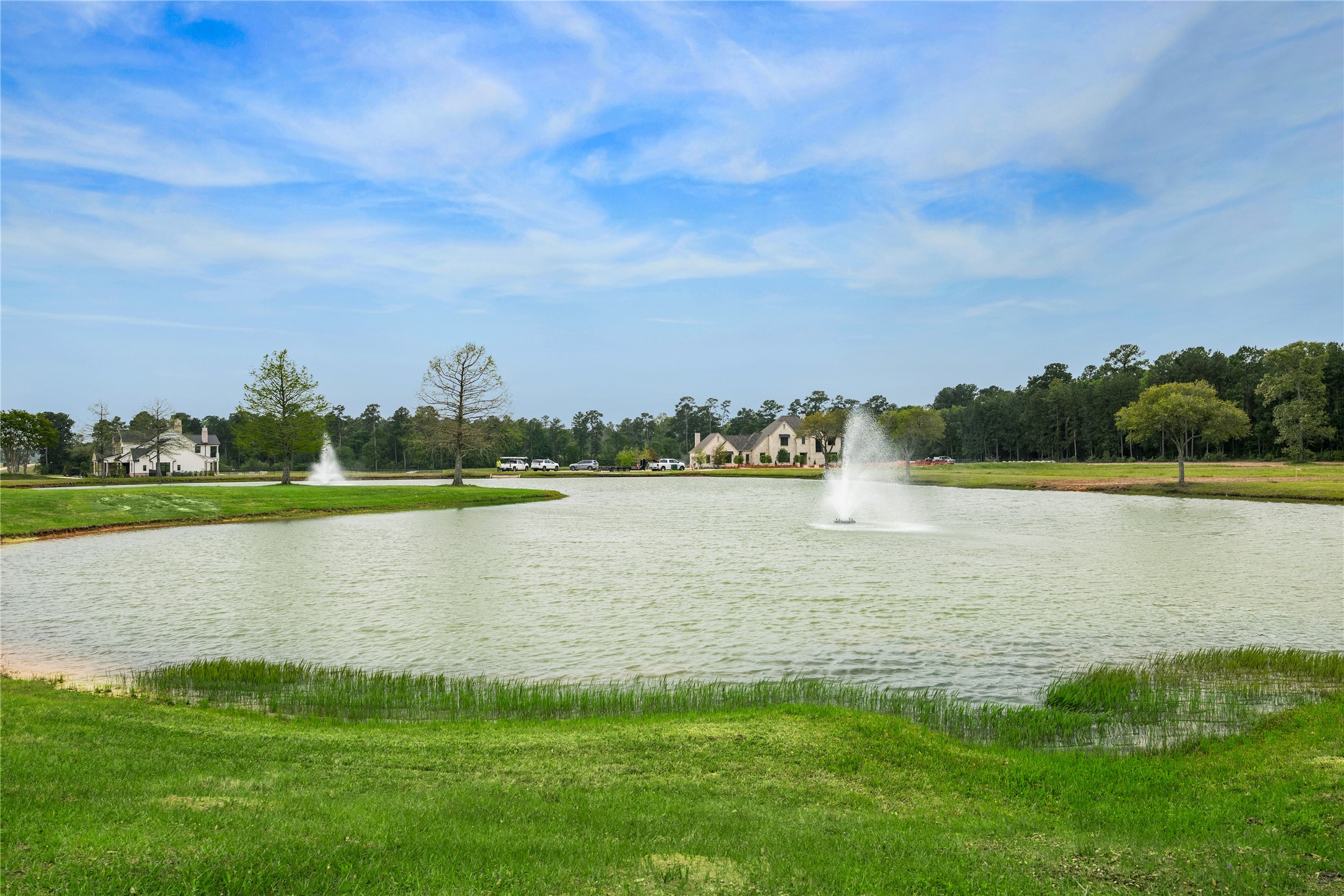 2044 Stallion Lakes Avenue Hockley, TX 77447 - Photo 15 of 17 The lake and fountain create a peaceful focal point within the neighborhood. It's a scenic backdrop that adds to the community’s charm.