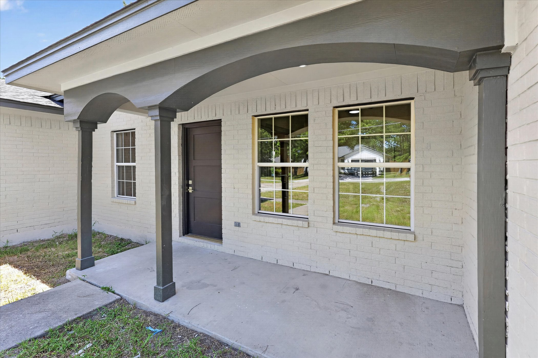 258 Pine View Loop Bastrop, TX 78602 - Photo 5 of 40 A welcoming covered porch with substantial columns offers shelter at the home's entrance.