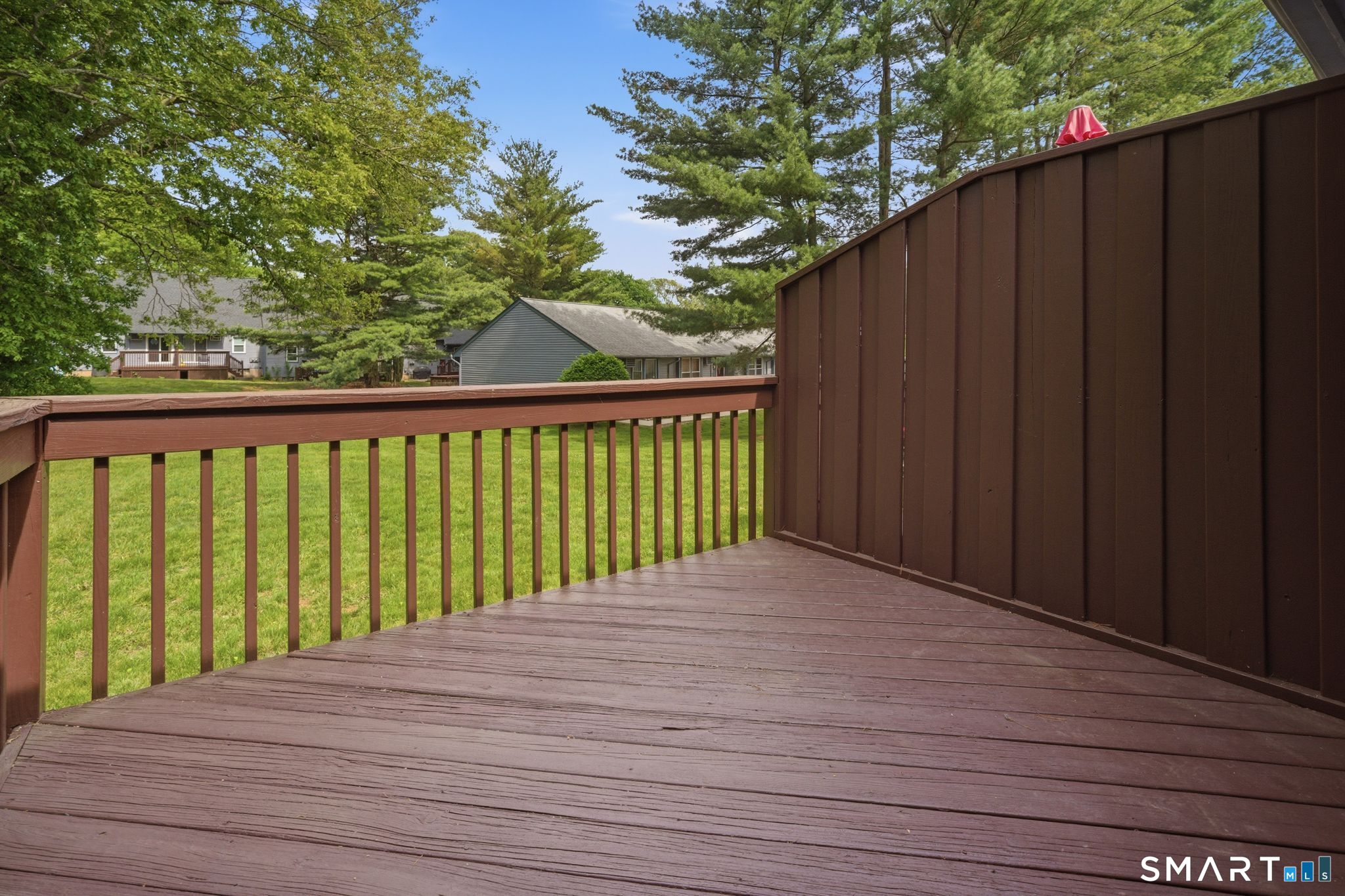1 Abbott Road, Unit 112 Ellington, CT 06029 - Photo 8 of 16 Wood deck with views of the grounds