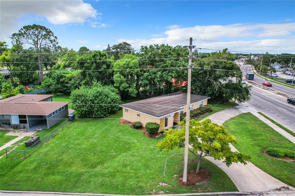825 North Pine Hills Road Orlando, FL 32808 - Photo 6 of 8 an aerial view of a house with garden space and street view