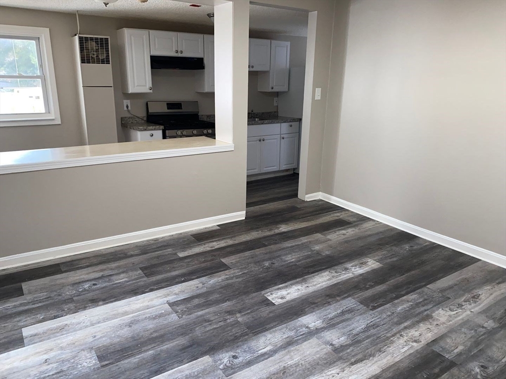 99 Mammoth Road, Unit 2 Lowell, MA 01854 - Photo 3 of 7 a view of a living room