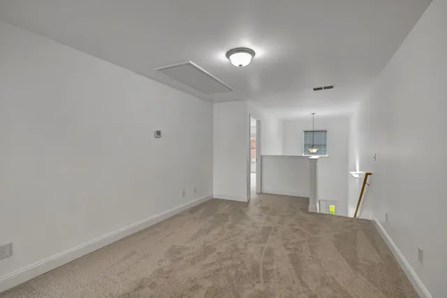 a view of an empty room with a sink