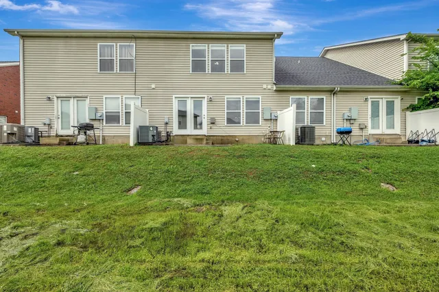a view of a house with a backyard