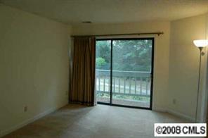 1606 Sharon Road West, Unit 34W Charlotte, NC 28210 - Photo 6 of 8 a view of an empty room and window