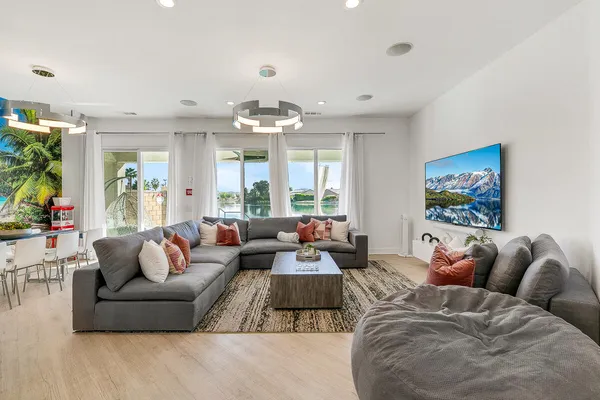 a living room with furniture and a large window