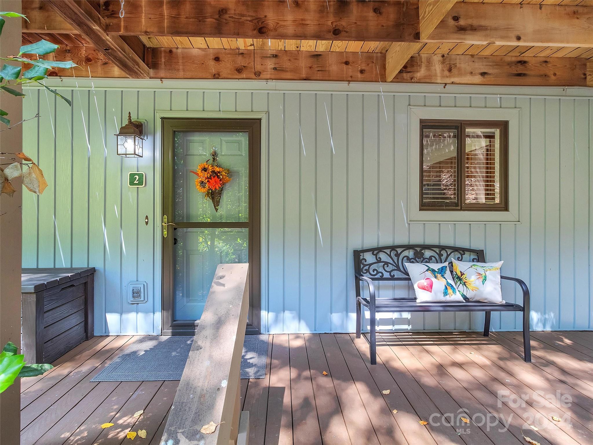87 Willow Road, Unit B2 Waynesville, NC 28786 - Photo 4 of 38 a outdoor space with lots of furniture and potted plants