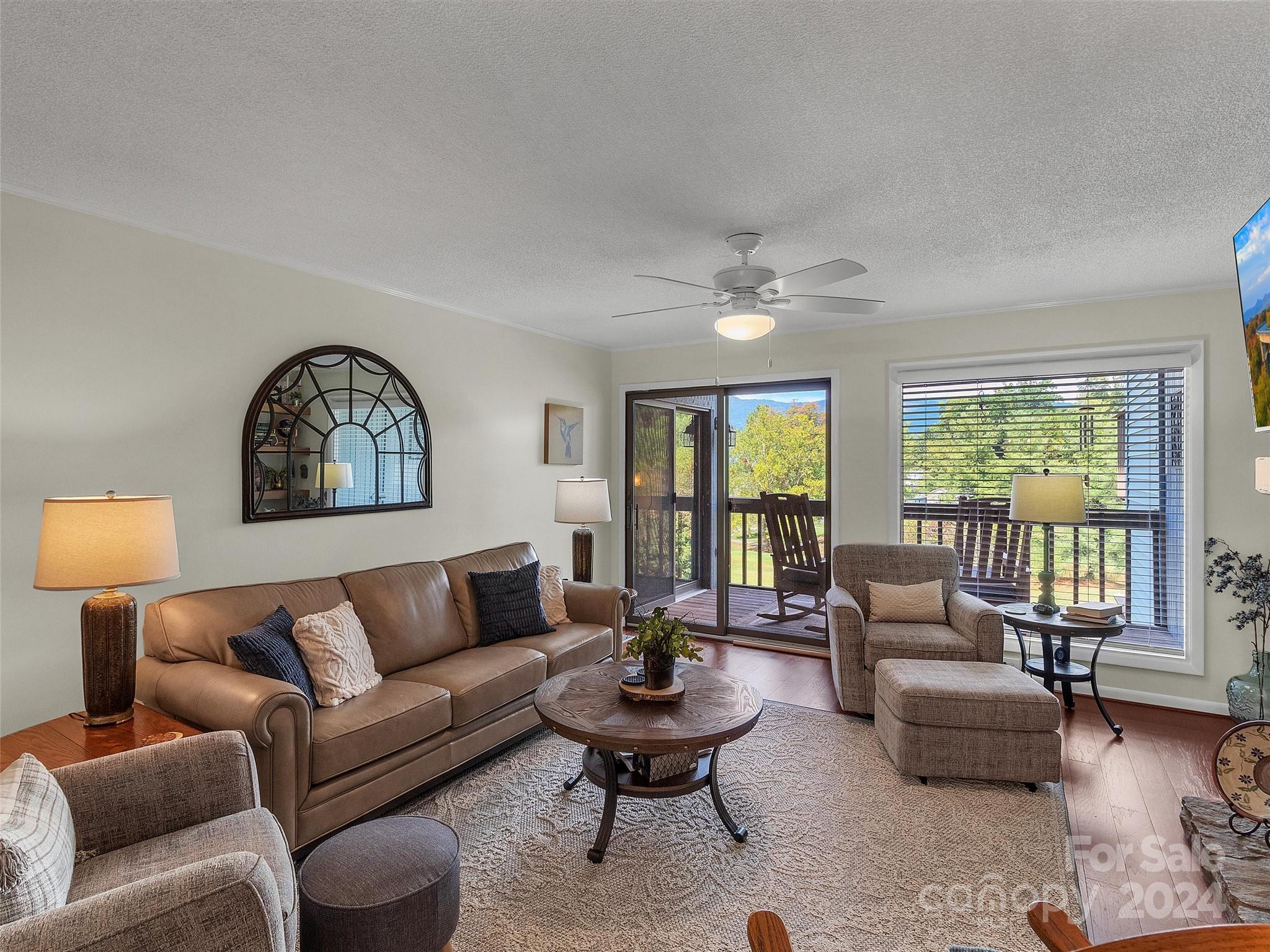 87 Willow Road, Unit B2 Waynesville, NC 28786 - Photo 7 of 38 a living room with furniture and a large window