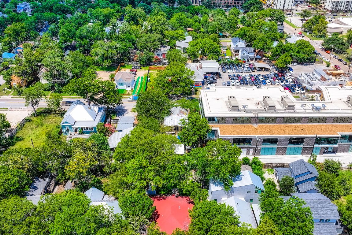 1409 East Cesar Chavez Street Austin, TX 78702 - Photo 4 of 11 an aerial view of residential building with outdoor space and lake view