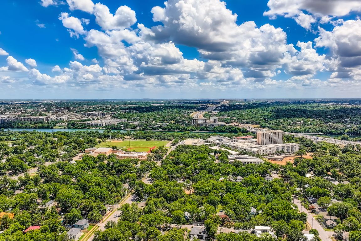 1409 East Cesar Chavez Street Austin, TX 78702 - Photo 10 of 11 a view of a lake with houses in back