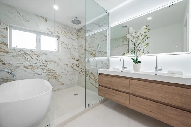 a bathroom with a bathtub and a sink