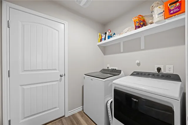 a utility room with dryer and washer