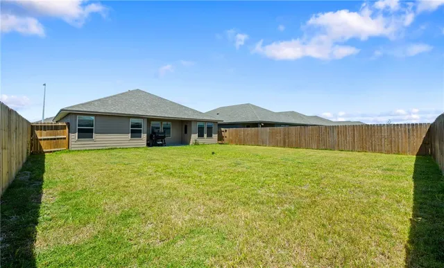 a view of a house with a garden
