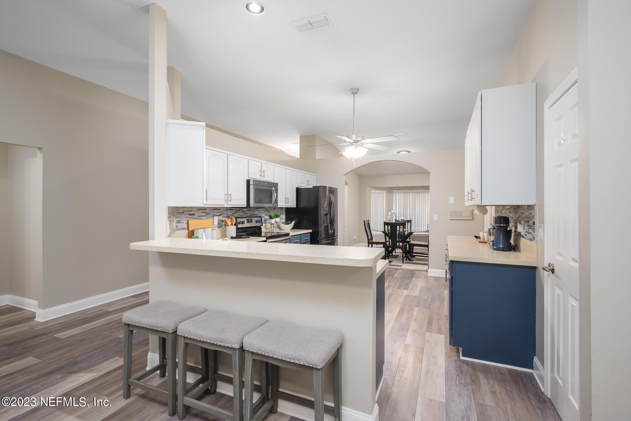 775 Camp Francis Johnson Road Orange Park, FL 32065 - Photo 15 of 41 a view of a kitchen and dining table chairs