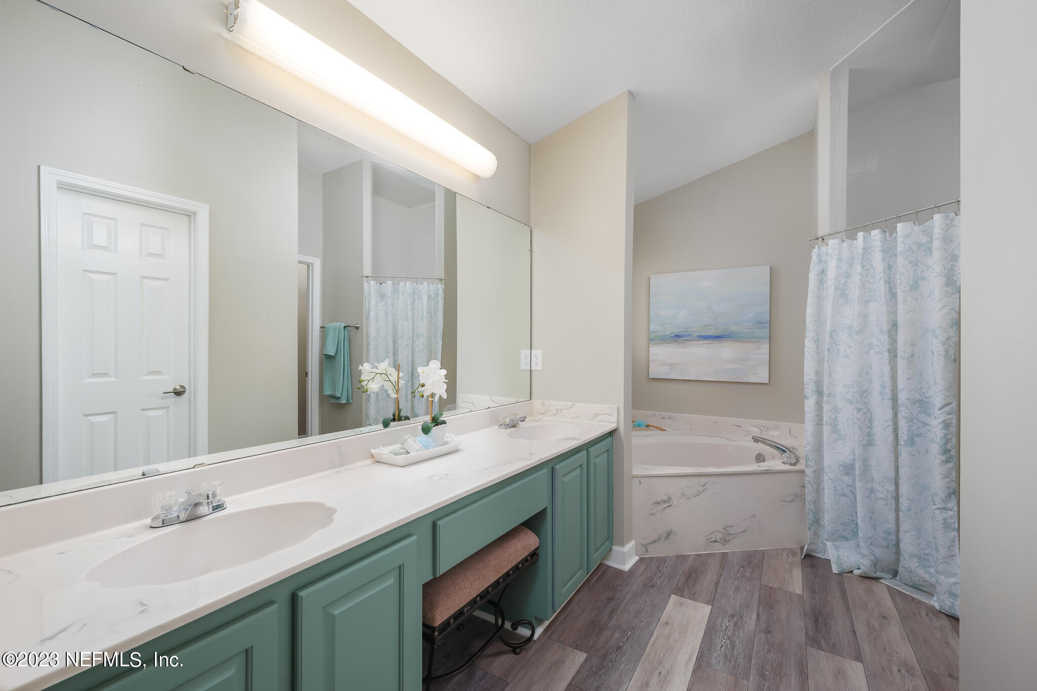 775 Camp Francis Johnson Road Orange Park, FL 32065 - Photo 23 of 41 a bathroom with a double vanity sink a mirror and a bathtub