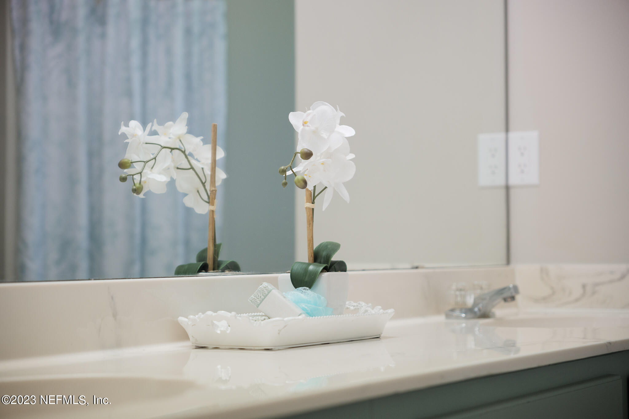 775 Camp Francis Johnson Road Orange Park, FL 32065 - Photo 24 of 41 a bathroom with a sink a mirror and a potted plant