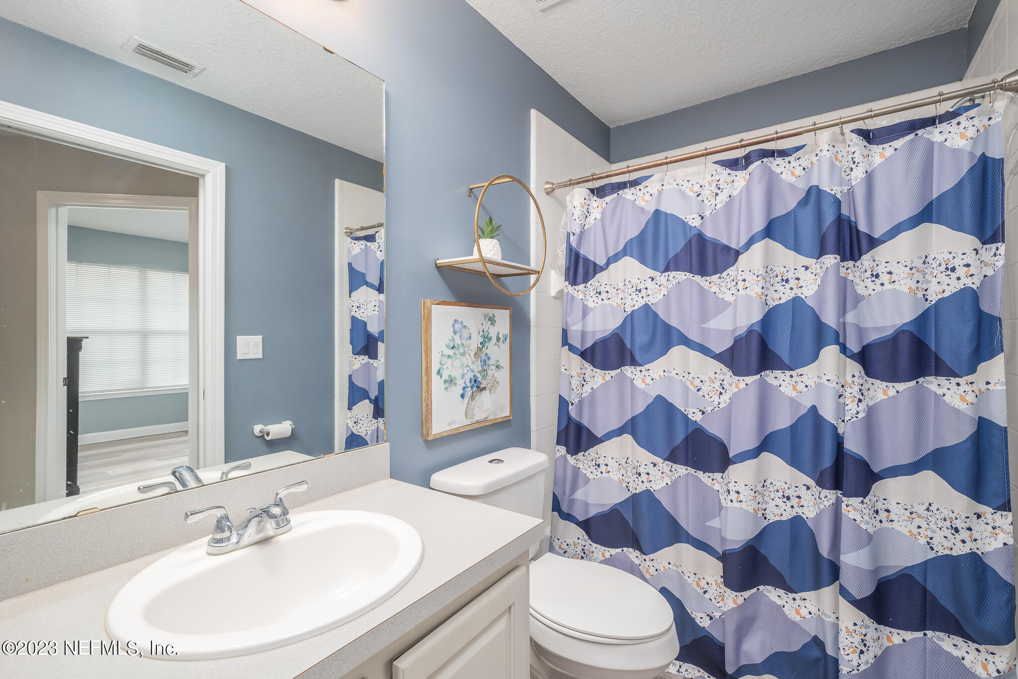 775 Camp Francis Johnson Road Orange Park, FL 32065 - Photo 30 of 41 a bathroom with a sink and mirror