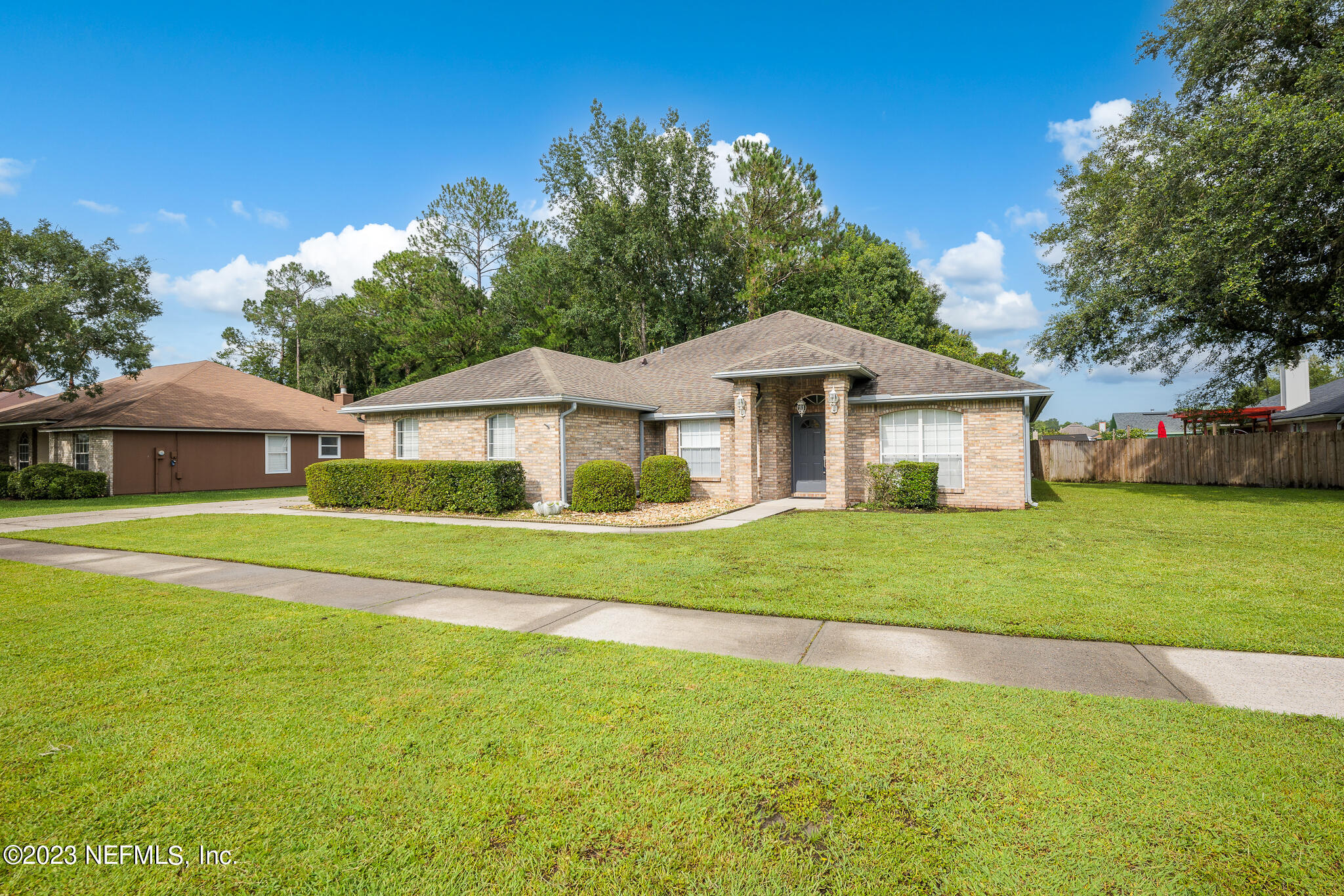 775 Camp Francis Johnson Road Orange Park, FL 32065 - Photo 3 of 41 a front view of a house with a yard