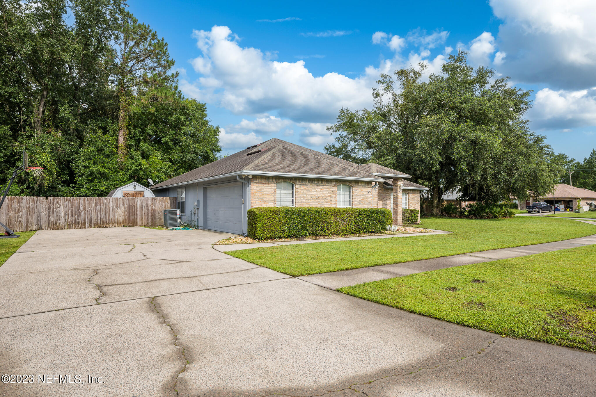775 Camp Francis Johnson Road Orange Park, FL 32065 - Photo 4 of 41 a front view of a house with yard and green space