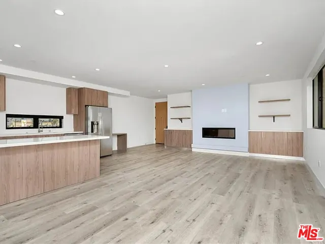 a view of kitchen with cabinets and wooden floor