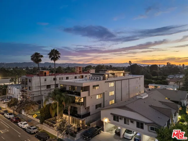 a picture of floor with a white wall and a painting