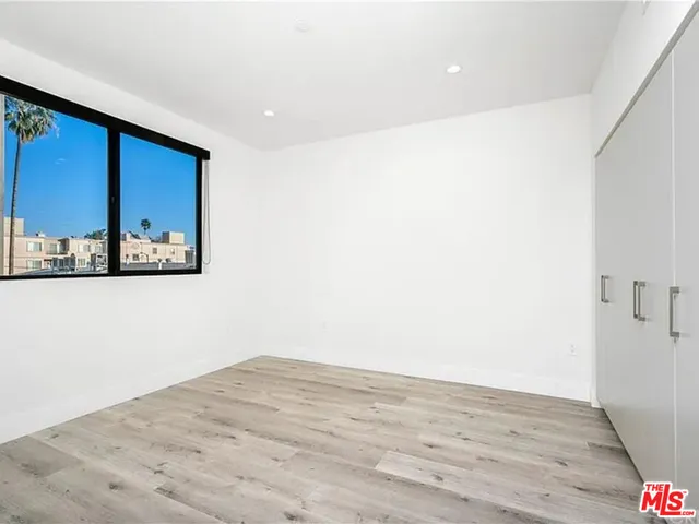a view of a room with wooden floor and small space