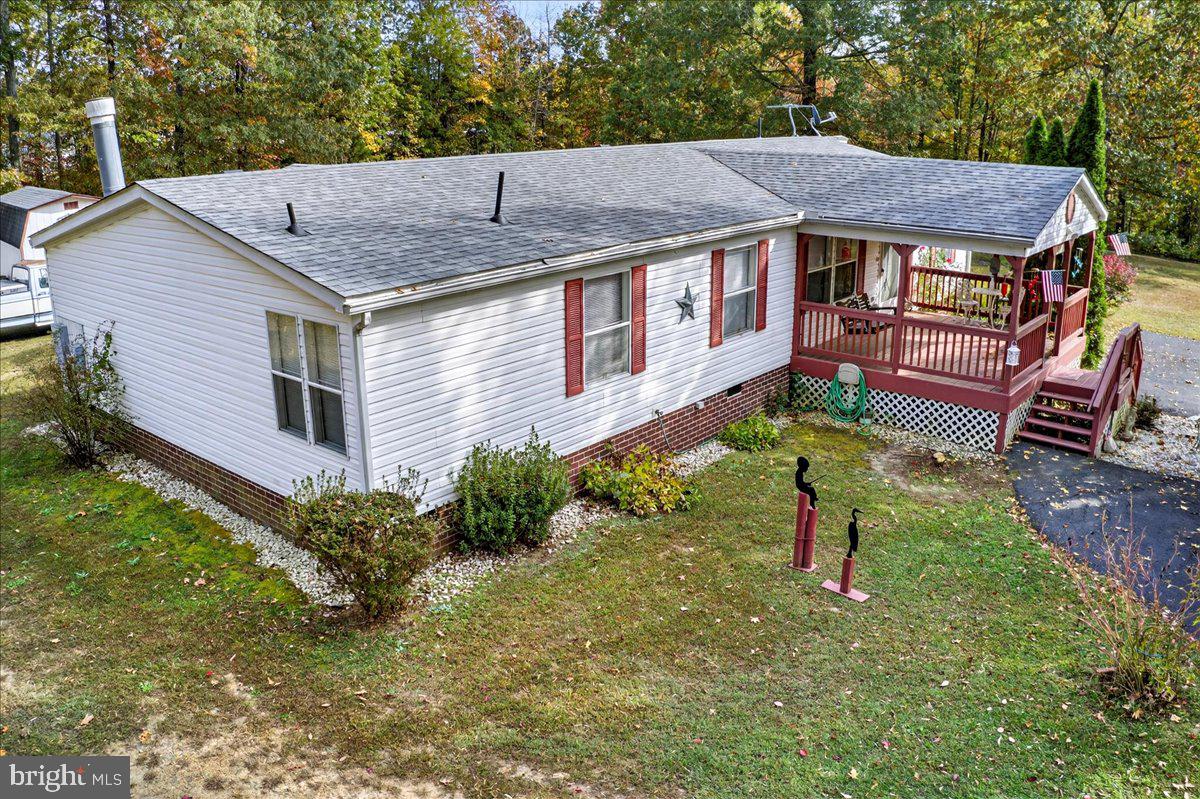 220 Chalklevel Road Louisa, VA 23093 - Photo 1 of 63 a aerial view of a house with a yard table and chairs
