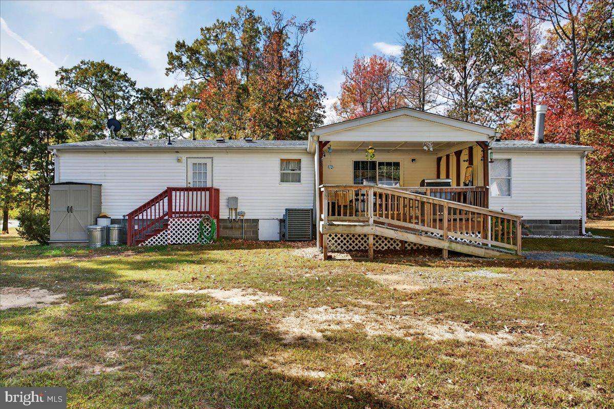 220 Chalklevel Road Louisa, VA 23093 - Photo 12 of 63 a view of a house with a yard and deck