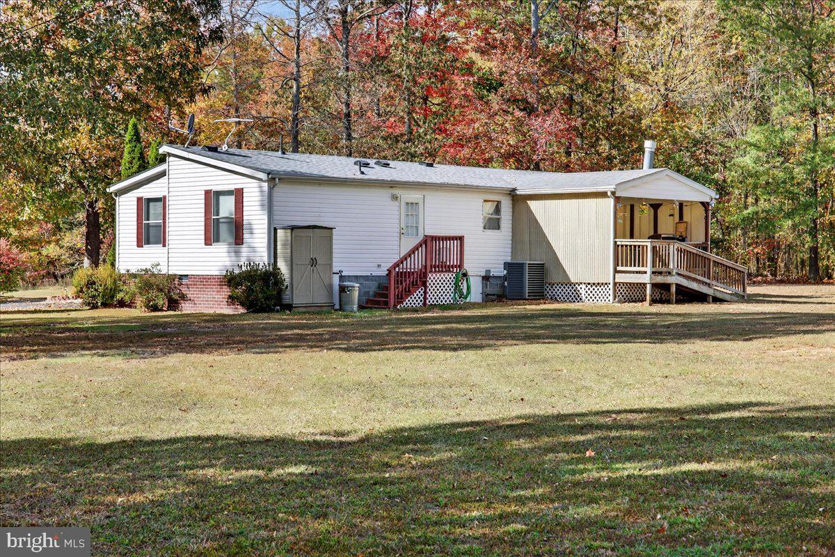 220 Chalklevel Road Louisa, VA 23093 - Photo 13 of 63 a front view of house with yard and swimming pool