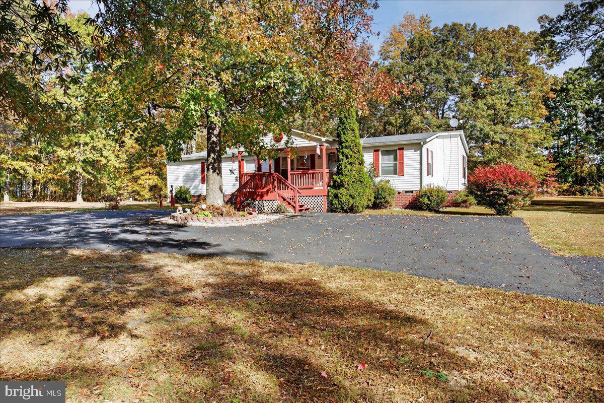220 Chalklevel Road Louisa, VA 23093 - Photo 14 of 63 a front view of a house with a yard and a garage