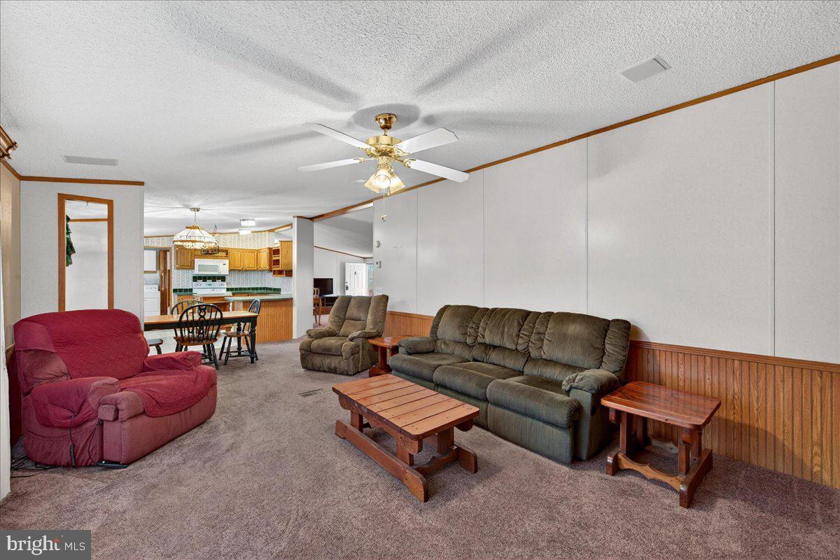 220 Chalklevel Road Louisa, VA 23093 - Photo 38 of 63 a living room with furniture kitchen view and a chandelier