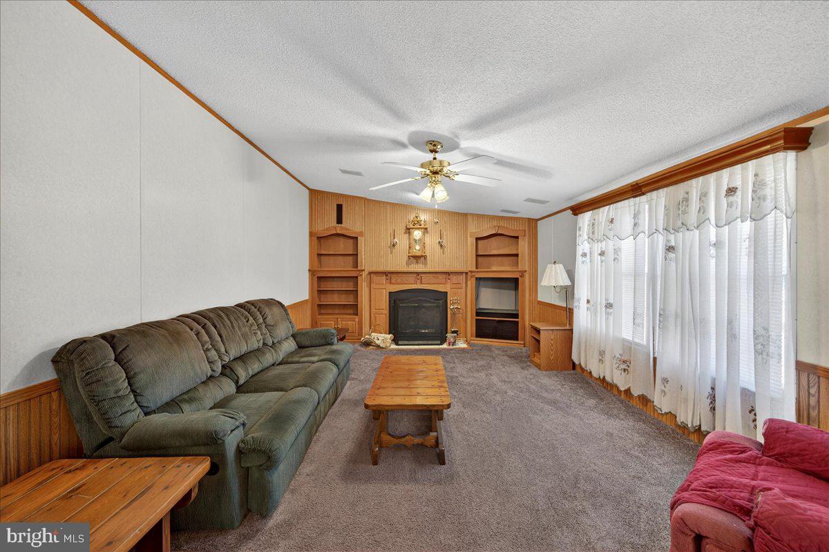 220 Chalklevel Road Louisa, VA 23093 - Photo 40 of 63 a living room with furniture and a fireplace