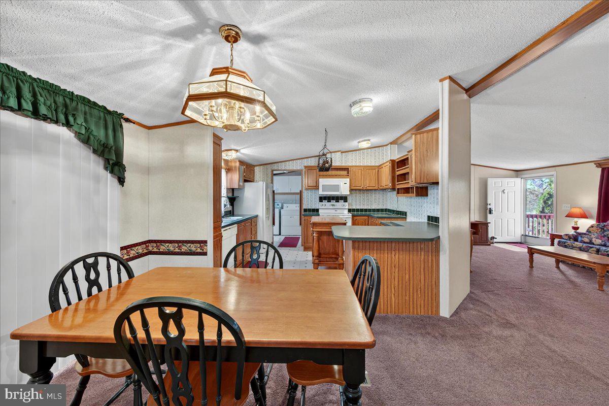 220 Chalklevel Road Louisa, VA 23093 - Photo 41 of 63 a view of a dining room with furniture and chandelier