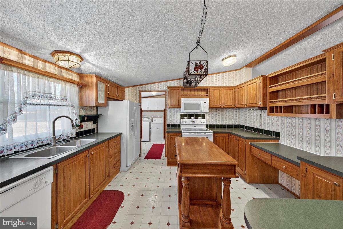 220 Chalklevel Road Louisa, VA 23093 - Photo 43 of 63 a kitchen with stainless steel appliances granite countertop a sink stove and refrigerator