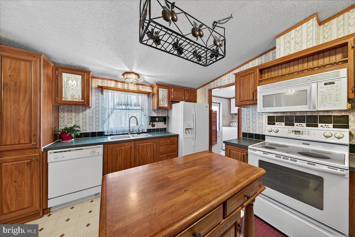 220 Chalklevel Road Louisa, VA 23093 - Photo 45 of 63 a kitchen with stainless steel appliances granite countertop a stove and cabinets
