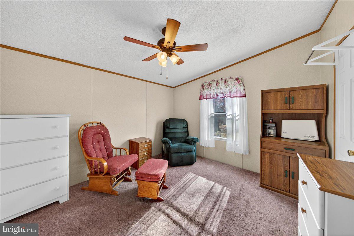 220 Chalklevel Road Louisa, VA 23093 - Photo 53 of 63 a living room with furniture a flat screen tv and a chandelier