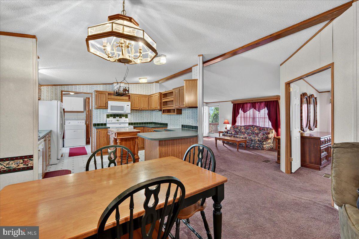 220 Chalklevel Road Louisa, VA 23093 - Photo 58 of 63 a view of a dining room with furniture and a chandelier