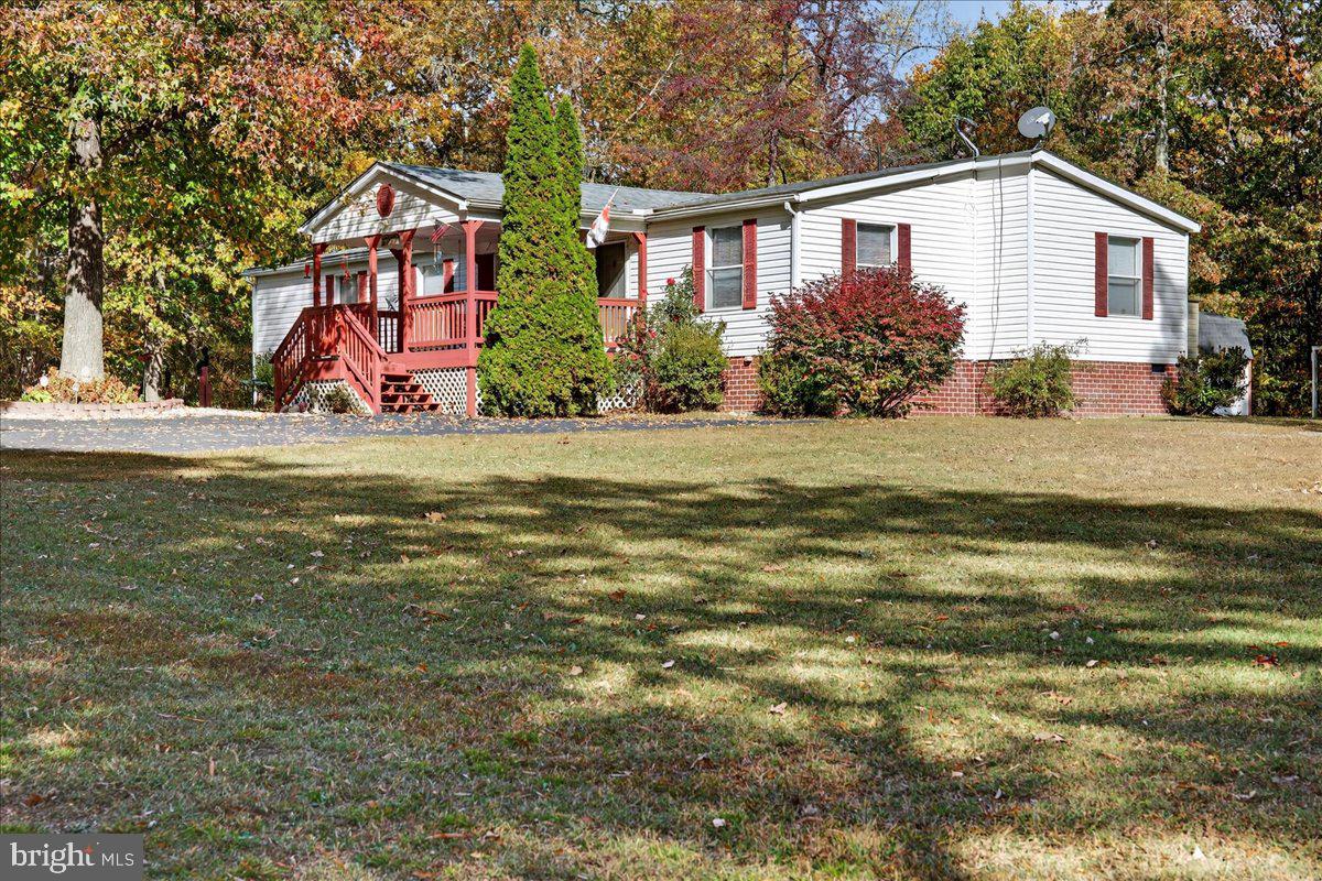 220 Chalklevel Road Louisa, VA 23093 - Photo 8 of 63 a front view of a house with garden