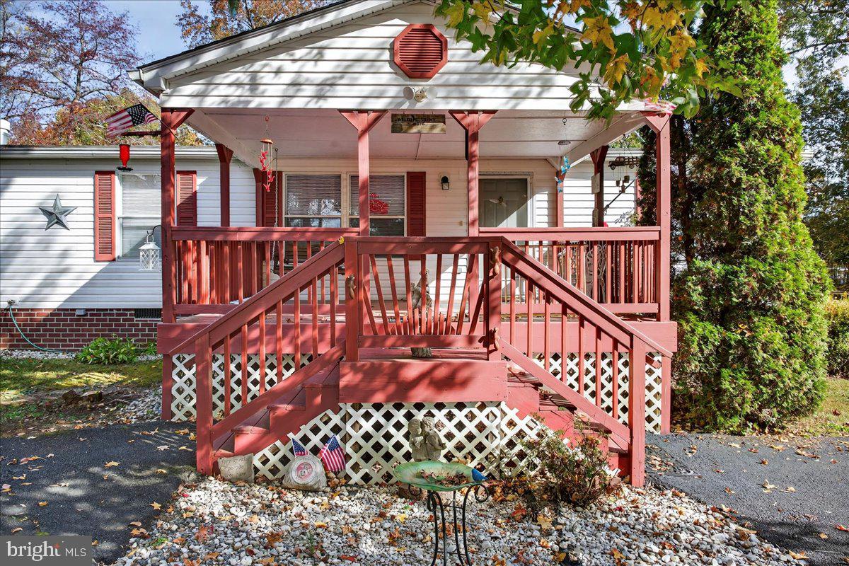 220 Chalklevel Road Louisa, VA 23093 - Photo 10 of 63 a view of a brick house with wooden deck