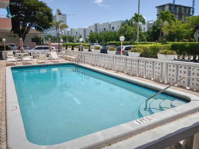 a view of a potted flower in front of buildings